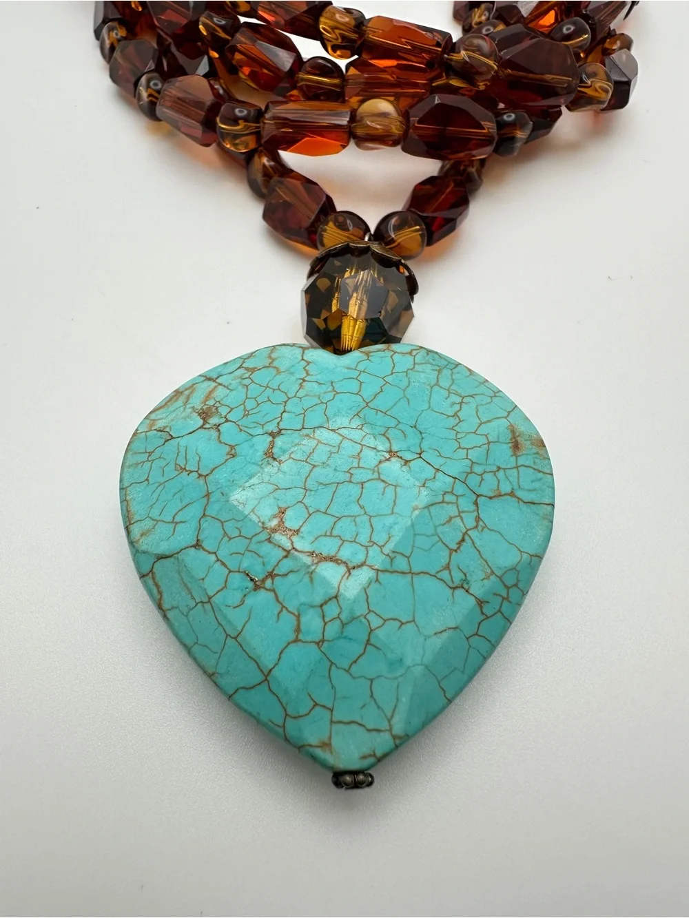 Multi-Strand Amber Glass Necklace with Turquoise Heart Pendant